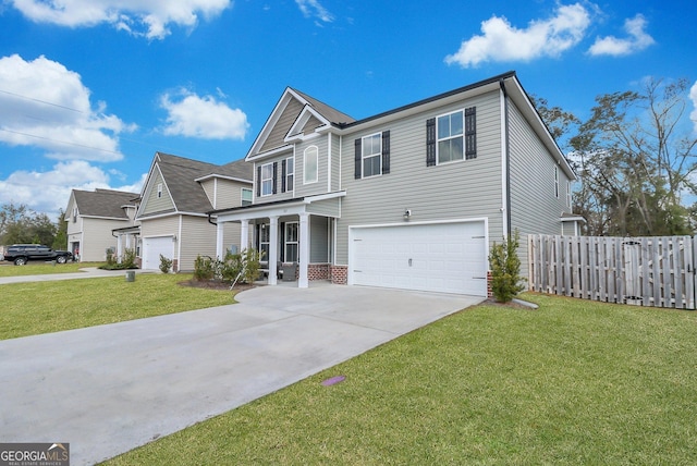 view of front of house featuring a garage, a front lawn, and covered porch