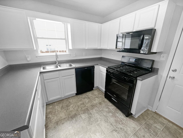 kitchen featuring sink, black appliances, and white cabinets