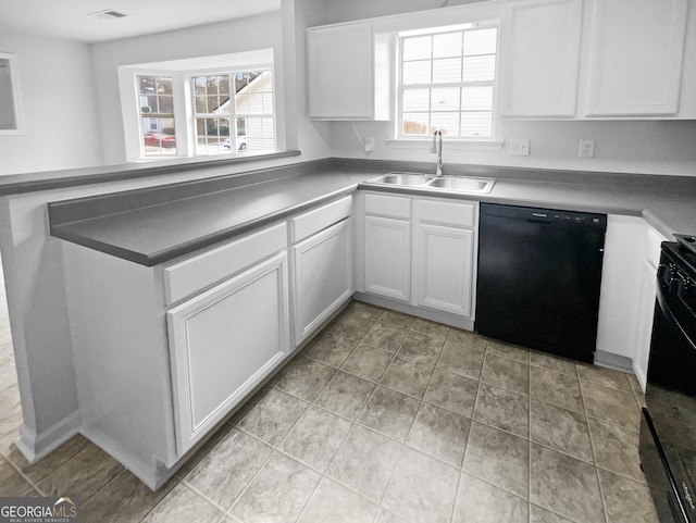 kitchen featuring sink, white cabinets, and black appliances