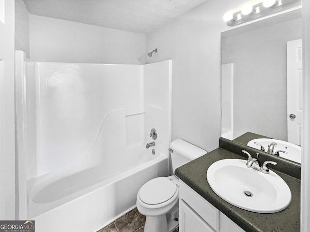 full bathroom with vanity, bathing tub / shower combination, and toilet