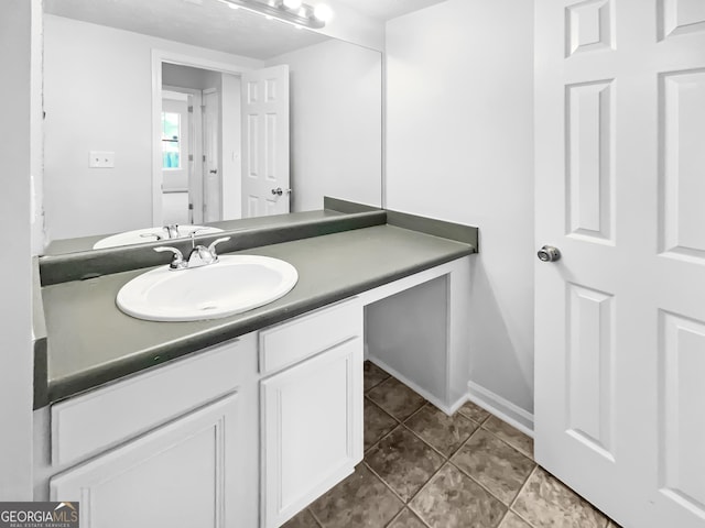 bathroom with tile patterned flooring and vanity