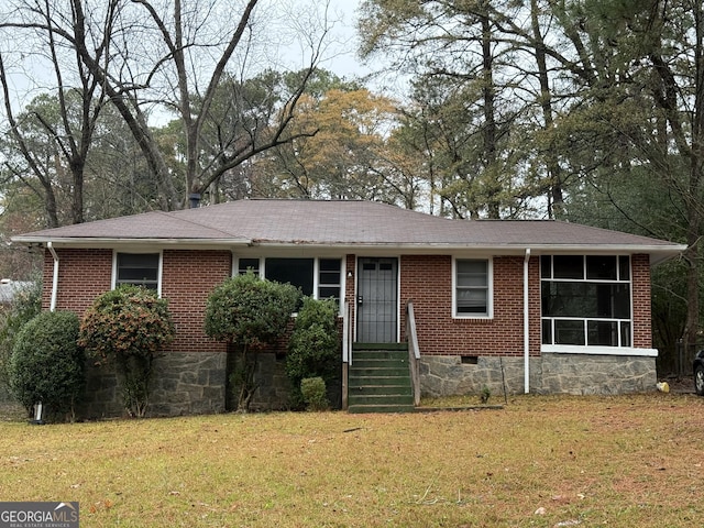 single story home with a front yard