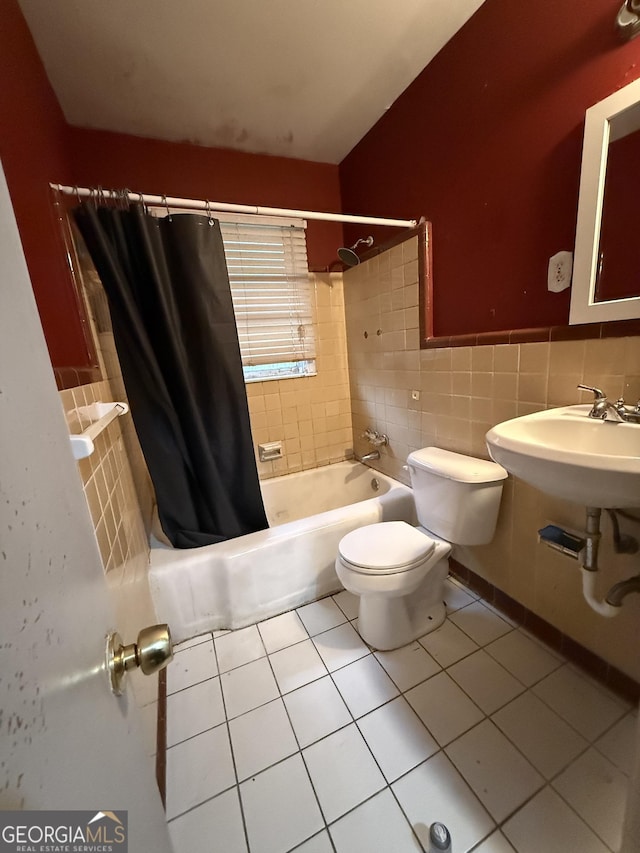 bathroom featuring tile patterned flooring, tile walls, shower / bathtub combination with curtain, and toilet