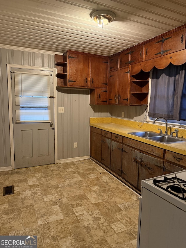 kitchen with sink and white range with gas stovetop