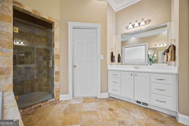 bathroom with ornamental molding, a shower with shower door, and vanity