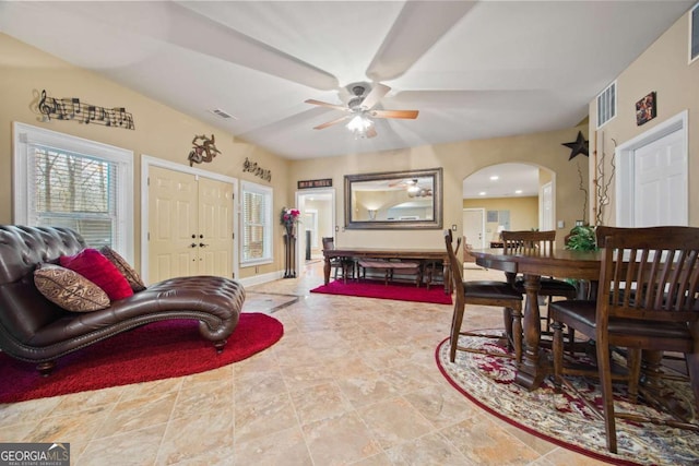 interior space with ceiling fan