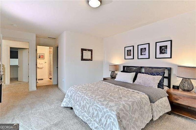 bedroom with light colored carpet