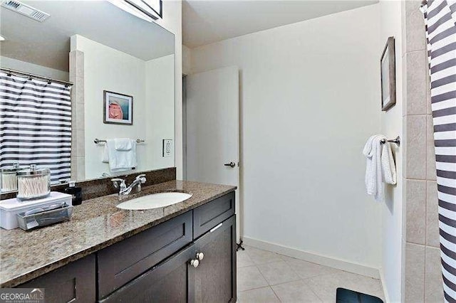 bathroom with vanity and tile patterned flooring