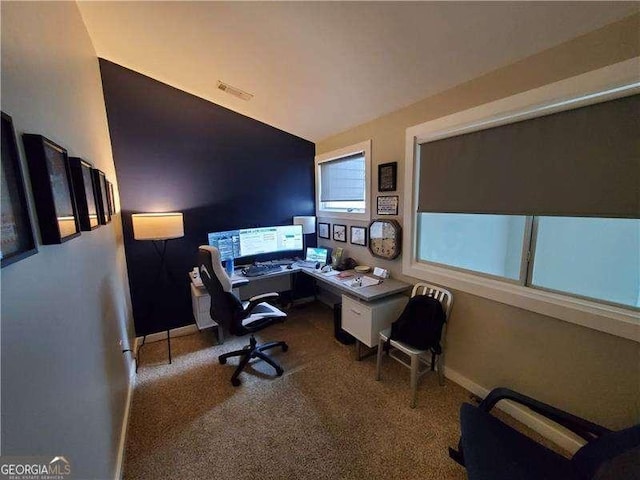 office with vaulted ceiling and carpet