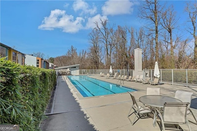 view of pool featuring a patio