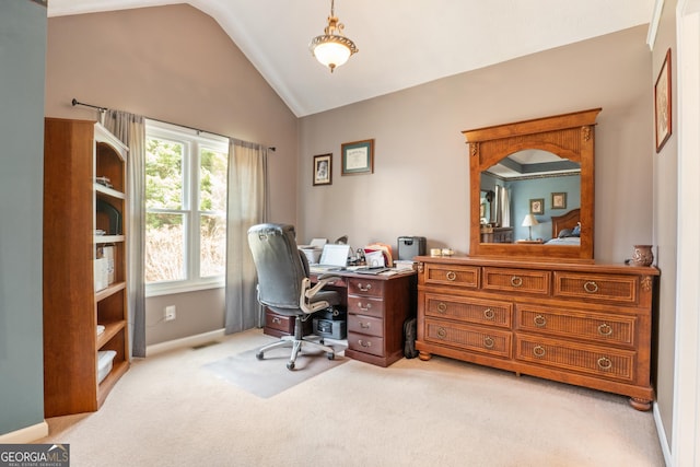 office with lofted ceiling and light colored carpet