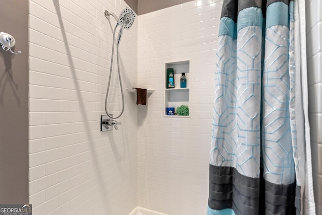 bathroom featuring walk in shower