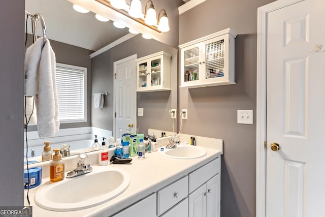 bathroom with vanity and a tub