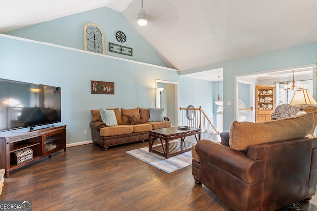 living room with ceiling fan, dark hardwood / wood-style floors, and high vaulted ceiling