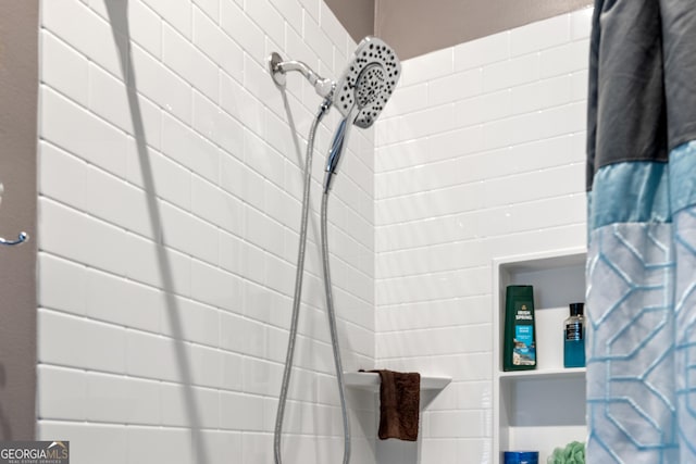 bathroom featuring curtained shower