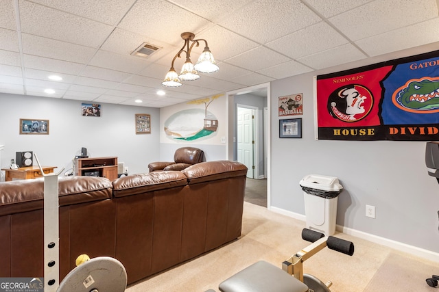 living room featuring light colored carpet and a drop ceiling