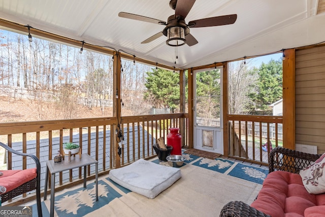 sunroom / solarium featuring vaulted ceiling and ceiling fan