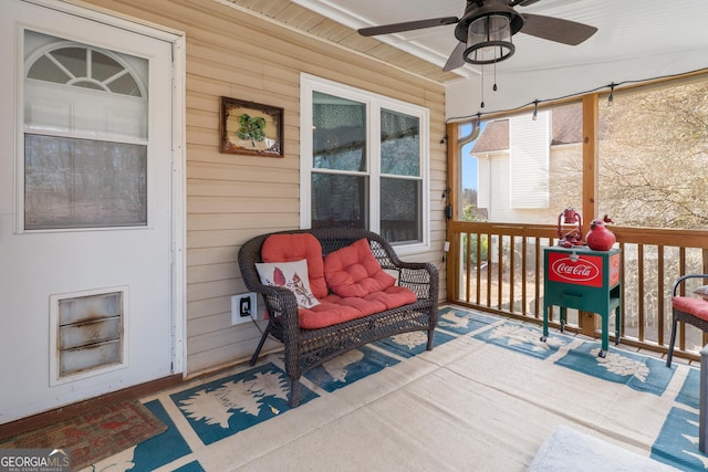 wooden terrace featuring ceiling fan