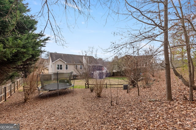 view of yard with a trampoline