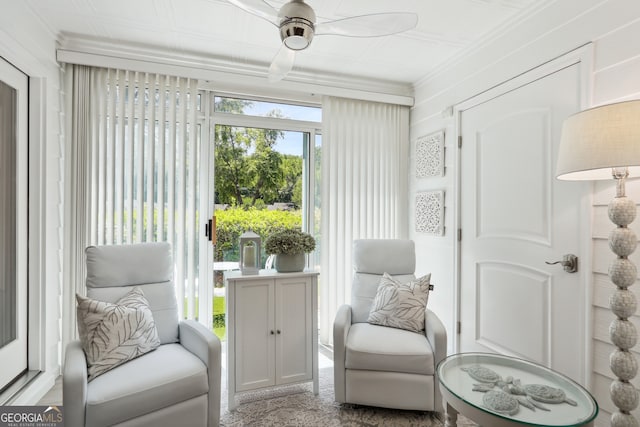 living area with ceiling fan