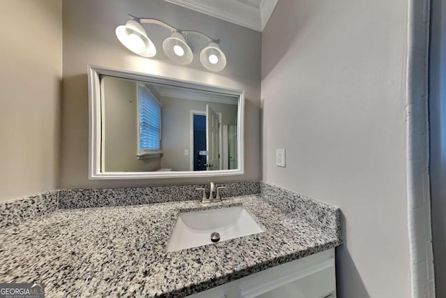 bathroom featuring crown molding and vanity