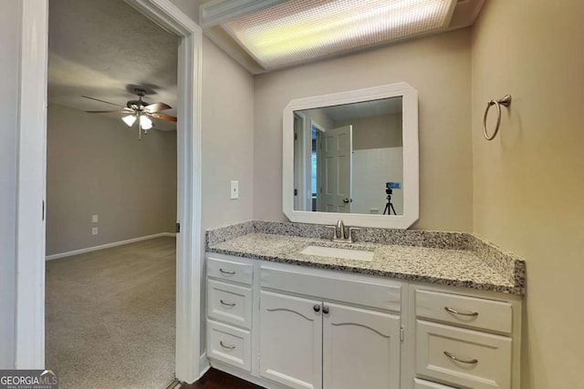 bathroom featuring vanity and ceiling fan