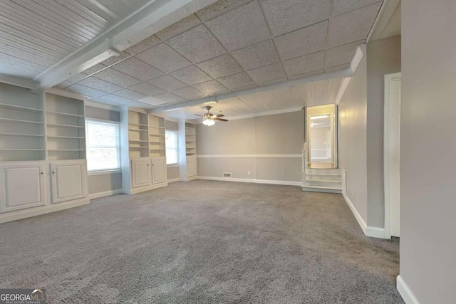 empty room with ceiling fan and carpet flooring