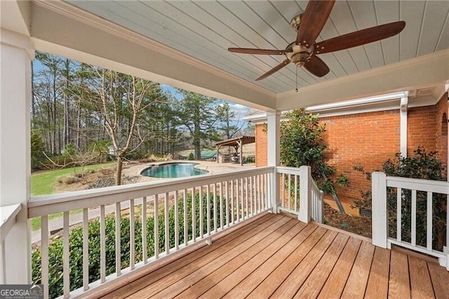 wooden deck with ceiling fan