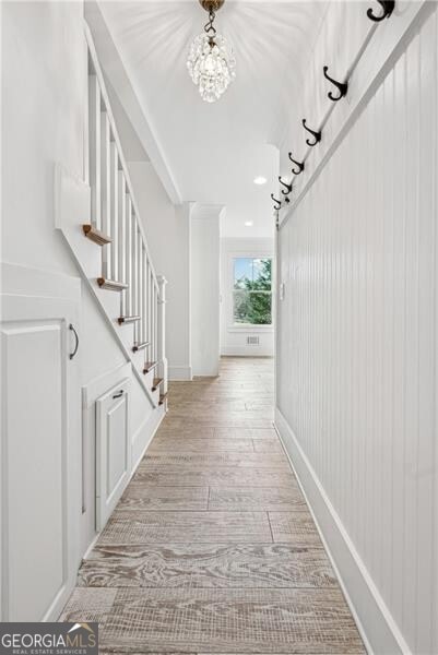 hallway with light wood-type flooring