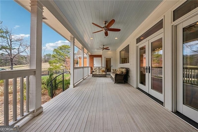 wooden deck with french doors and ceiling fan