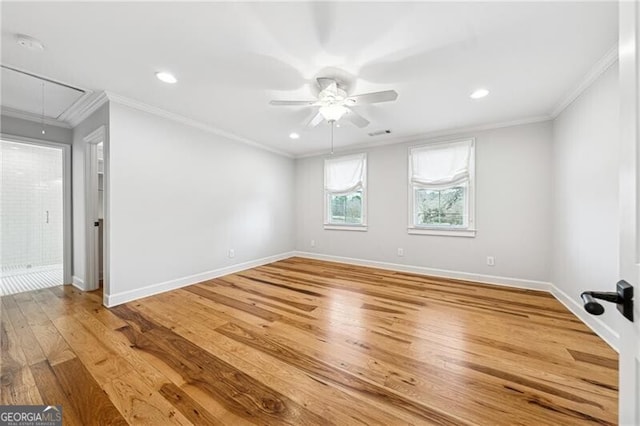 spare room with ceiling fan, ornamental molding, and hardwood / wood-style floors