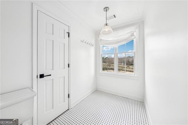 hallway featuring ornamental molding