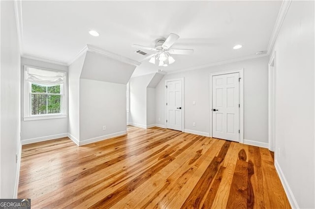 bonus room with light hardwood / wood-style floors and ceiling fan