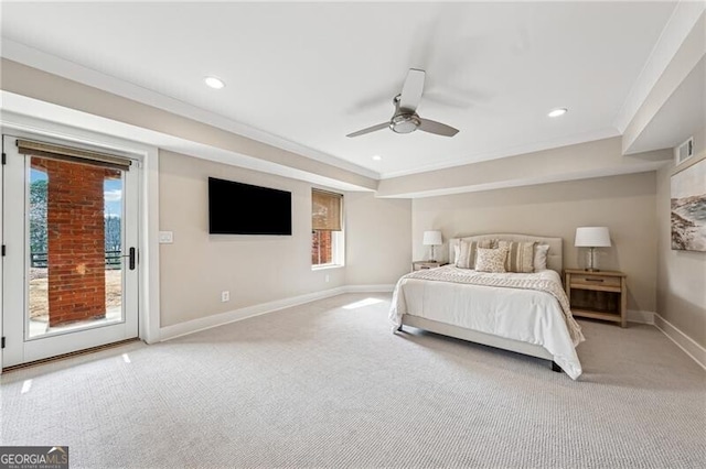 carpeted bedroom featuring access to exterior, crown molding, a raised ceiling, and ceiling fan