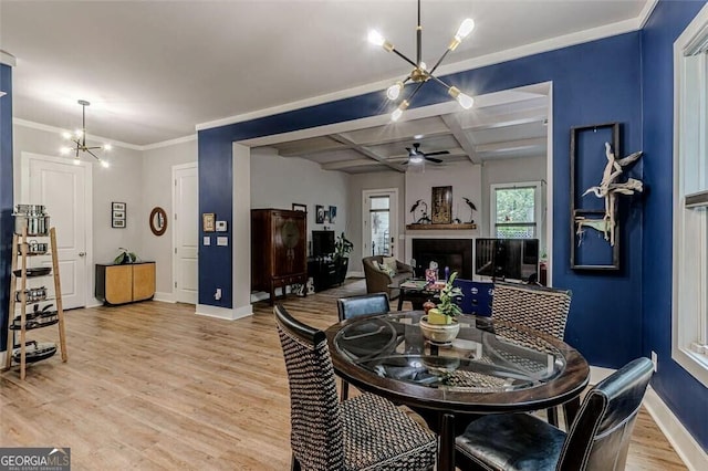 3157 Oakdale Rd, Hapeville, GA 30354 - dining area featuring a chandelier, baseboards, light wood-style floors, a ceiling fan, and coffered ceiling