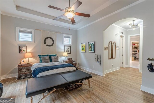 3157 Oakdale Rd, Hapeville, GA 30354 - bedroom featuring ornamental molding, wood finished floors, a raised ceiling, baseboards, and ceiling fan