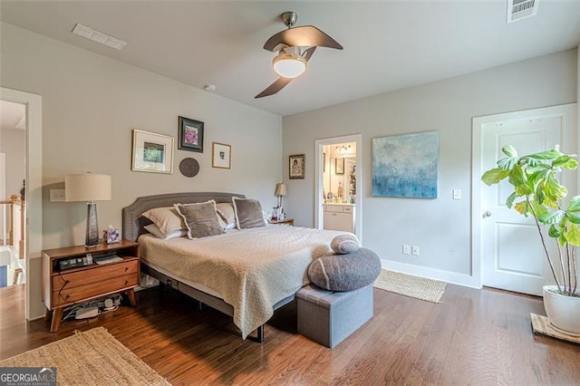 3157 Oakdale Rd, Hapeville, GA 30354 - bedroom with wood finished floors, baseboards, a ceiling fan, and ensuite bathroom