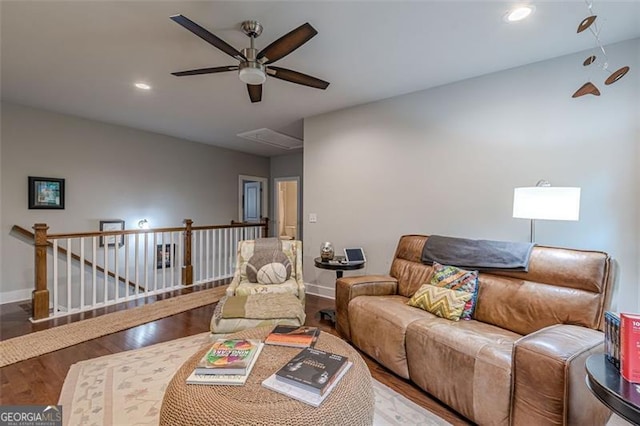 living room with ceiling fan, attic access, recessed lighting, baseboards, and wood finished floors