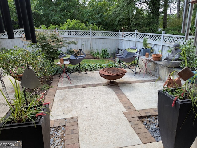 3157 Oakdale Rd, Hapeville, GA 30354 - view of patio featuring fence and an outdoor fire pit