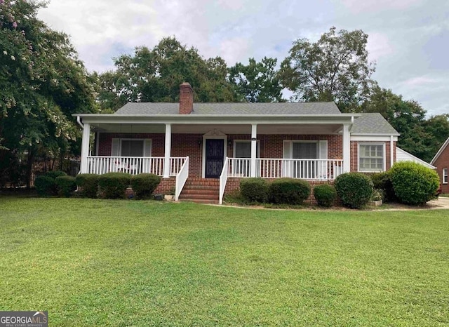 view of front of house featuring a front yard and a porch