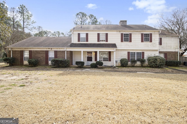 front facade featuring a front lawn