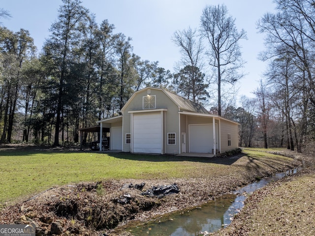 garage featuring a yard