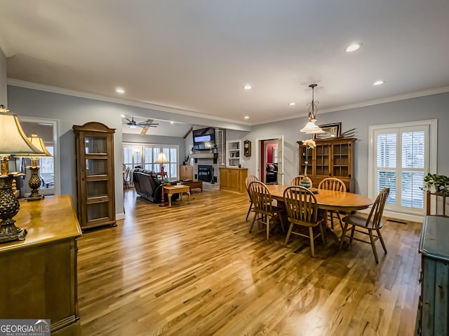 dining area featuring hardwood / wood-style floors, a healthy amount of sunlight, and ceiling fan