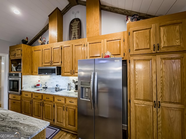 kitchen featuring wood ceiling, vaulted ceiling with beams, tasteful backsplash, light stone counters, and appliances with stainless steel finishes