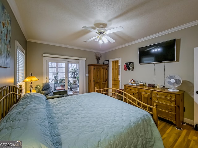 bedroom featuring access to outside, ornamental molding, ceiling fan, a textured ceiling, and hardwood / wood-style floors