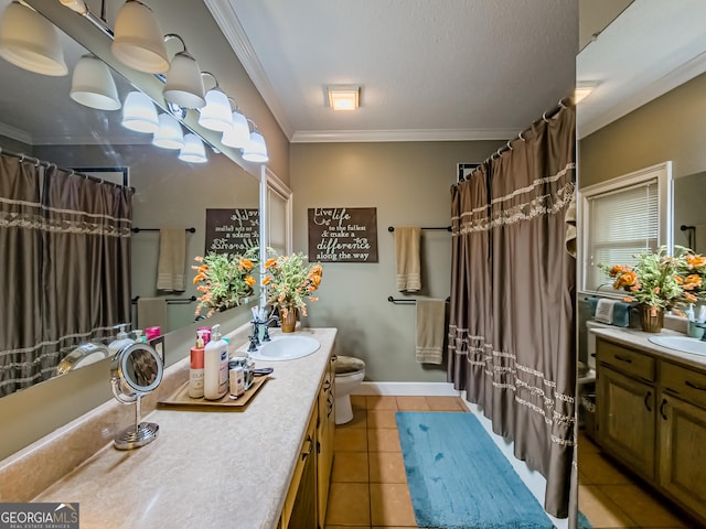 bathroom featuring toilet, a textured ceiling, crown molding, tile patterned floors, and vanity