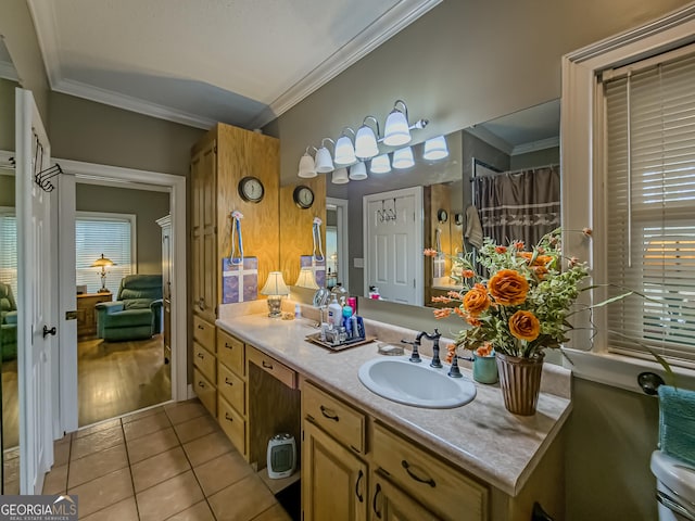 bathroom with vanity, tile patterned flooring, and crown molding