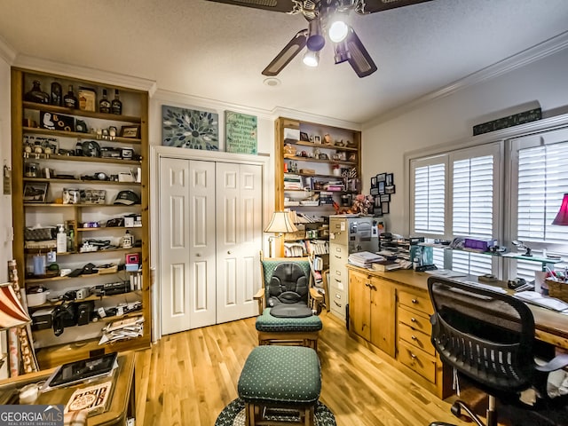 office area featuring a textured ceiling, crown molding, ceiling fan, and light hardwood / wood-style flooring