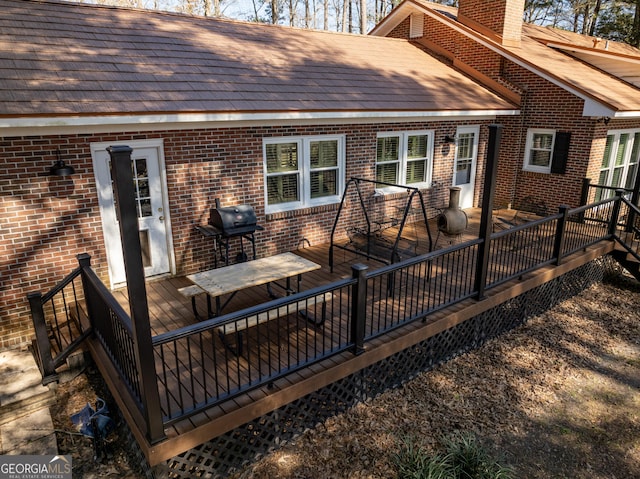 back of house featuring a wooden deck