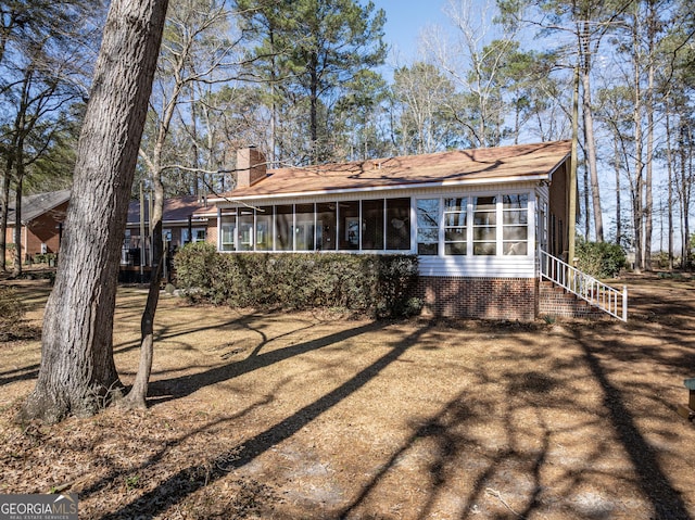 exterior space with a sunroom